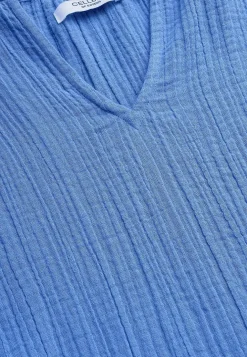 Blus i krinklad bomull