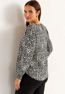Blus med smock i ärmsluten
