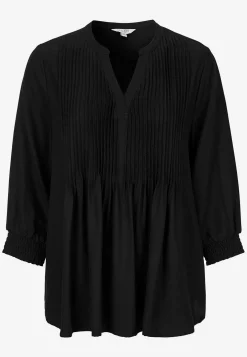 Blus med sydda veck