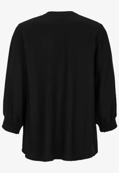 Blus med sydda veck