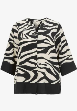 Blus med zebramönster