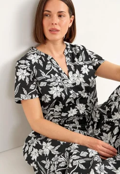 Bomullsklänning med volang