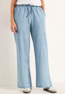 Byxa i denim med vida ben