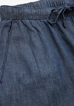 Byxa i denim med vida ben