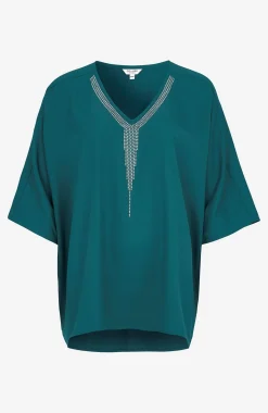 Festblus med nitdetaljer