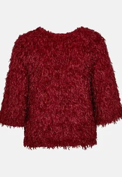 Festtopp med fjäderliknande material