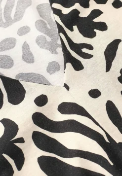 Ärmlös trikåtopp med v-ringning