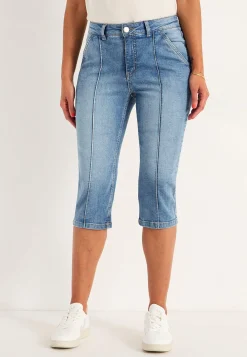 Stretchiga caprijeans med sytt pressveck