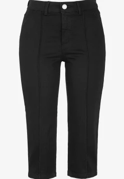 Stretchiga caprijeans med sytt pressveck